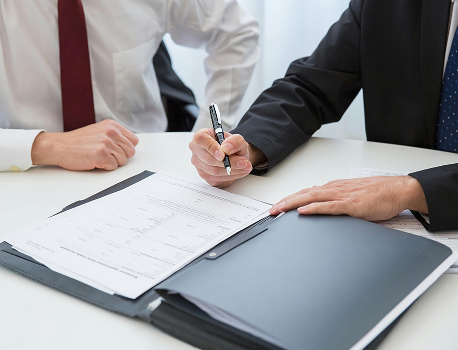 Person signing a document Person signing a document